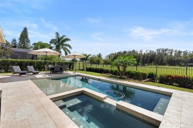 Discover luxury living in this exquisite five-bedroom on Eagle Creek Golf Club in Florida - for sale on GolfHomes.com, golf home, golf lot