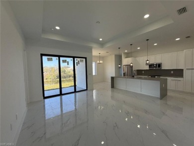 Welcome to a breathtaking new construction single-family home on Del Tura Golf and Country Club in Florida - for sale on GolfHomes.com, golf home, golf lot