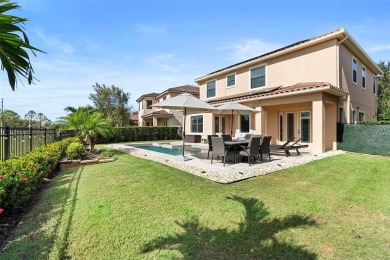 Discover luxury living in this exquisite five-bedroom on Eagle Creek Golf Club in Florida - for sale on GolfHomes.com, golf home, golf lot