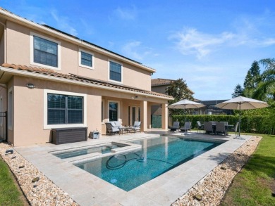 Discover luxury living in this exquisite five-bedroom on Eagle Creek Golf Club in Florida - for sale on GolfHomes.com, golf home, golf lot