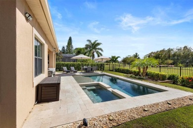 Discover luxury living in this exquisite five-bedroom on Eagle Creek Golf Club in Florida - for sale on GolfHomes.com, golf home, golf lot