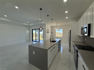 Welcome to a breathtaking new construction single-family home on Del Tura Golf and Country Club in Florida - for sale on GolfHomes.com, golf home, golf lot