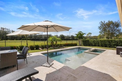 Discover luxury living in this exquisite five-bedroom on Eagle Creek Golf Club in Florida - for sale on GolfHomes.com, golf home, golf lot