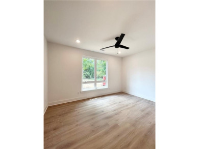 New construction on a spacious .31-acre wooded lot with a level on Bella Vista - Metfield Golf Complex and Country Club in Arkansas - for sale on GolfHomes.com, golf home, golf lot
