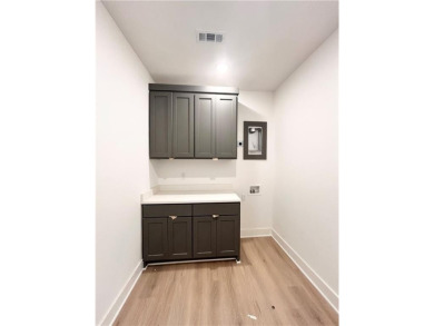 New construction on a spacious .31-acre wooded lot with a level on Bella Vista - Metfield Golf Complex and Country Club in Arkansas - for sale on GolfHomes.com, golf home, golf lot