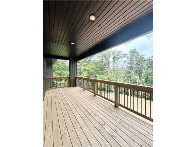 New construction on a spacious .31-acre wooded lot with a level on Bella Vista - Metfield Golf Complex and Country Club in Arkansas - for sale on GolfHomes.com, golf home, golf lot