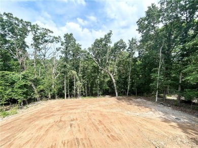 New construction on a spacious .31-acre wooded lot with a level on Bella Vista - Metfield Golf Complex and Country Club in Arkansas - for sale on GolfHomes.com, golf home, golf lot