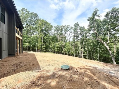 New construction on a spacious .31-acre wooded lot with a level on Bella Vista - Metfield Golf Complex and Country Club in Arkansas - for sale on GolfHomes.com, golf home, golf lot