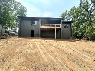 New construction on a spacious .31-acre wooded lot with a level on Bella Vista - Metfield Golf Complex and Country Club in Arkansas - for sale on GolfHomes.com, golf home, golf lot