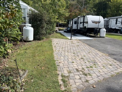 Absolutely beautiful creek front lot with large concrete deck on Bent Creek Golf Course in Tennessee - for sale on GolfHomes.com, golf home, golf lot
