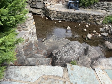 Absolutely beautiful creek front lot with large concrete deck on Bent Creek Golf Course in Tennessee - for sale on GolfHomes.com, golf home, golf lot