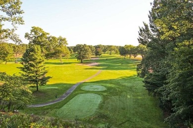 Experience refined living in this stunning golf course property on Muskegon Country Club in Michigan - for sale on GolfHomes.com, golf home, golf lot