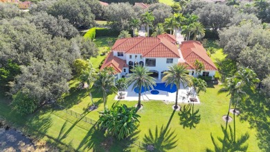 Experience unparalleled luxury in this 6,823-sq-ft under air on The Wanderers Club in Florida - for sale on GolfHomes.com, golf home, golf lot