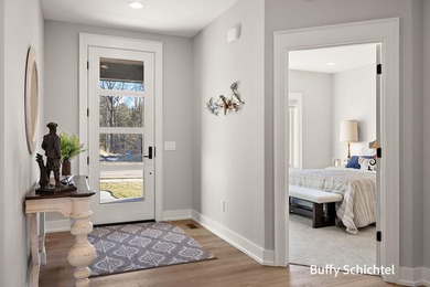 Experience refined living in this stunning golf course property on Muskegon Country Club in Michigan - for sale on GolfHomes.com, golf home, golf lot