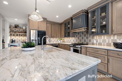 Experience refined living in this stunning golf course property on Muskegon Country Club in Michigan - for sale on GolfHomes.com, golf home, golf lot