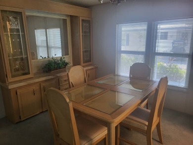 2/2 home has open floor plan. Large eat-in kitchen has lots of on Lake Henry Golf Club in Florida - for sale on GolfHomes.com, golf home, golf lot