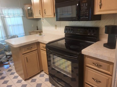2/2 home has open floor plan. Large eat-in kitchen has lots of on Lake Henry Golf Club in Florida - for sale on GolfHomes.com, golf home, golf lot