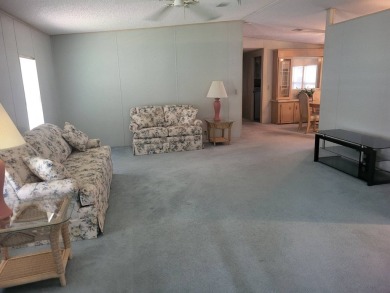 2/2 home has open floor plan. Large eat-in kitchen has lots of on Lake Henry Golf Club in Florida - for sale on GolfHomes.com, golf home, golf lot