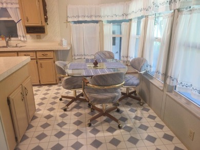 2/2 home has open floor plan. Large eat-in kitchen has lots of on Lake Henry Golf Club in Florida - for sale on GolfHomes.com, golf home, golf lot