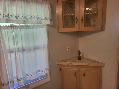 2/2 home has open floor plan. Large eat-in kitchen has lots of on Lake Henry Golf Club in Florida - for sale on GolfHomes.com, golf home, golf lot