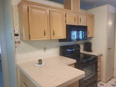 2/2 home has open floor plan. Large eat-in kitchen has lots of on Lake Henry Golf Club in Florida - for sale on GolfHomes.com, golf home, golf lot