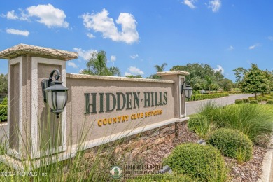 Welcome to your dream pool home in prestigious Hidden Hills on Hidden Hills Country Club in Florida - for sale on GolfHomes.com, golf home, golf lot