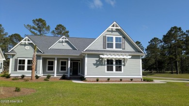 Discover the Skiff, a beautiful new Logan Home, located in on Sea Trail Golf Resort in North Carolina - for sale on GolfHomes.com, golf home, golf lot