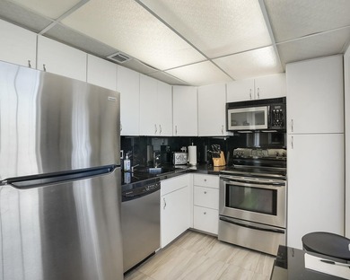 Beautifully remodeled 2BR/2BA top-floor condo in all-age Palm on  in Florida - for sale on GolfHomes.com, golf home, golf lot