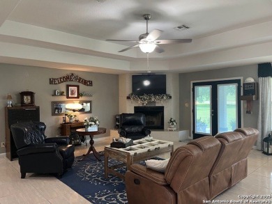 Beautifully maintained immaculate home located on the third hole on Devine Golf Course in Texas - for sale on GolfHomes.com, golf home, golf lot