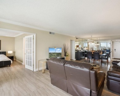 Beautifully remodeled 2BR/2BA top-floor condo in all-age Palm on  in Florida - for sale on GolfHomes.com, golf home, golf lot