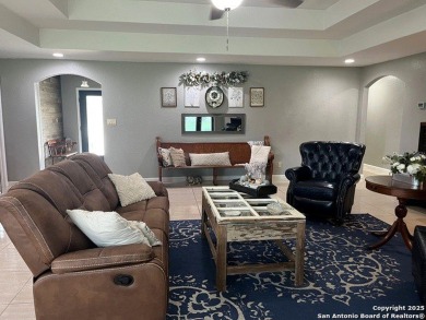 Beautifully maintained immaculate home located on the third hole on Devine Golf Course in Texas - for sale on GolfHomes.com, golf home, golf lot