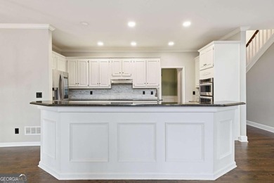 Welcome to this gorgeous traditional home perfectly situated on on Canongate At Eagle Watch Golf Club in Georgia - for sale on GolfHomes.com, golf home, golf lot