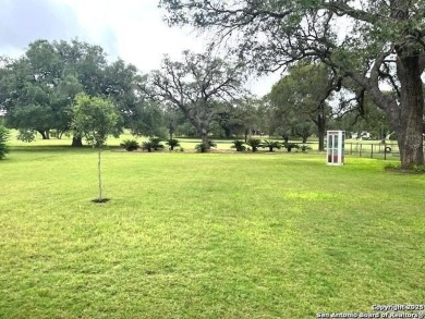 Beautifully maintained immaculate home located on the third hole on Devine Golf Course in Texas - for sale on GolfHomes.com, golf home, golf lot