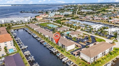 Just steps from your screened lanai to your private dock and on Saint Andrews South Golf Club in Florida - for sale on GolfHomes.com, golf home, golf lot