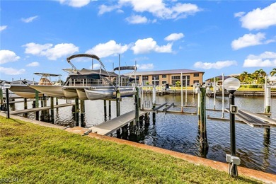 Just steps from your screened lanai to your private dock and on Saint Andrews South Golf Club in Florida - for sale on GolfHomes.com, golf home, golf lot