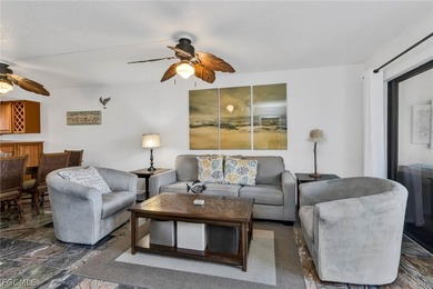 Just steps from your screened lanai to your private dock and on Saint Andrews South Golf Club in Florida - for sale on GolfHomes.com, golf home, golf lot