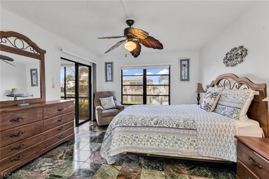 Just steps from your screened lanai to your private dock and on Saint Andrews South Golf Club in Florida - for sale on GolfHomes.com, golf home, golf lot