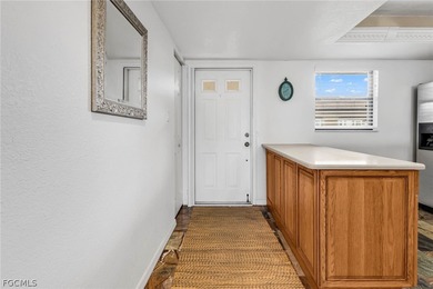 Just steps from your screened lanai to your private dock and on Saint Andrews South Golf Club in Florida - for sale on GolfHomes.com, golf home, golf lot