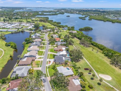 Under contract-accepting backup offers. This gorgeous tri-level on Seminole Lake Country Club in Florida - for sale on GolfHomes.com, golf home, golf lot