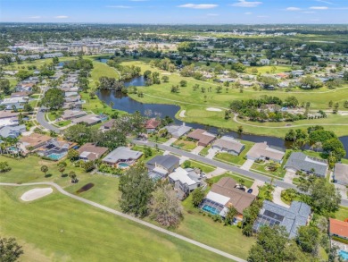 Under contract-accepting backup offers. This gorgeous tri-level on Seminole Lake Country Club in Florida - for sale on GolfHomes.com, golf home, golf lot