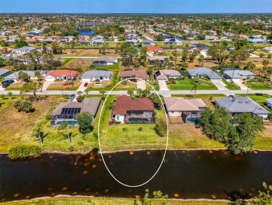 Waterfront Pool Home with Incredible Features in Rotonda West! on Rotonda Golf and Country Club - Long Marsh  in Florida - for sale on GolfHomes.com, golf home, golf lot