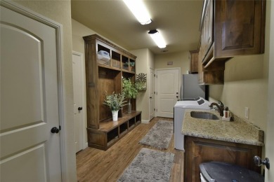 Luxury living on the golf course! Nestled along the 14th hole of on Pecan Plantation Country Club in Texas - for sale on GolfHomes.com, golf home, golf lot