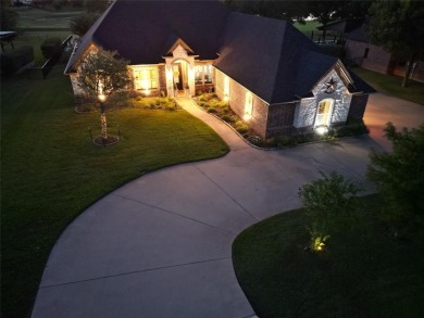 Luxury living on the golf course! Nestled along the 14th hole of on Pecan Plantation Country Club in Texas - for sale on GolfHomes.com, golf home, golf lot