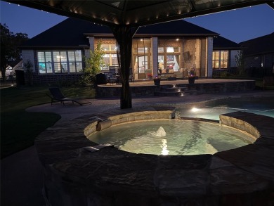 Luxury living on the golf course! Nestled along the 14th hole of on Pecan Plantation Country Club in Texas - for sale on GolfHomes.com, golf home, golf lot