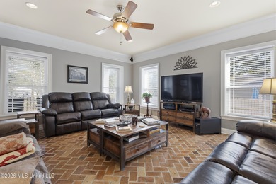 Welcome to this exceptional 4-bedroom, 5-bath custom waterfront on Sunkist Country Club, Inc. in Mississippi - for sale on GolfHomes.com, golf home, golf lot