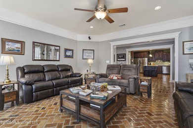 Welcome to this exceptional 4-bedroom, 5-bath custom waterfront on Sunkist Country Club, Inc. in Mississippi - for sale on GolfHomes.com, golf home, golf lot