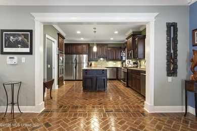 Welcome to this exceptional 4-bedroom, 5-bath custom waterfront on Sunkist Country Club, Inc. in Mississippi - for sale on GolfHomes.com, golf home, golf lot