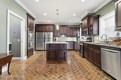 Welcome to this exceptional 4-bedroom, 5-bath custom waterfront on Sunkist Country Club, Inc. in Mississippi - for sale on GolfHomes.com, golf home, golf lot