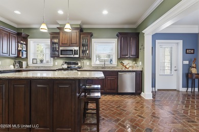 Welcome to this exceptional 4-bedroom, 5-bath custom waterfront on Sunkist Country Club, Inc. in Mississippi - for sale on GolfHomes.com, golf home, golf lot