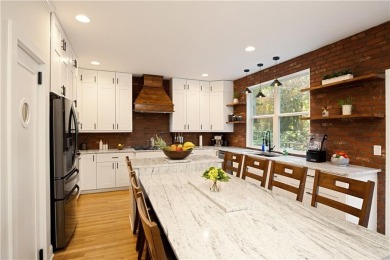 Price to move, this custom-built home sits on a roundabout on Hampton Golf Village in Georgia - for sale on GolfHomes.com, golf home, golf lot